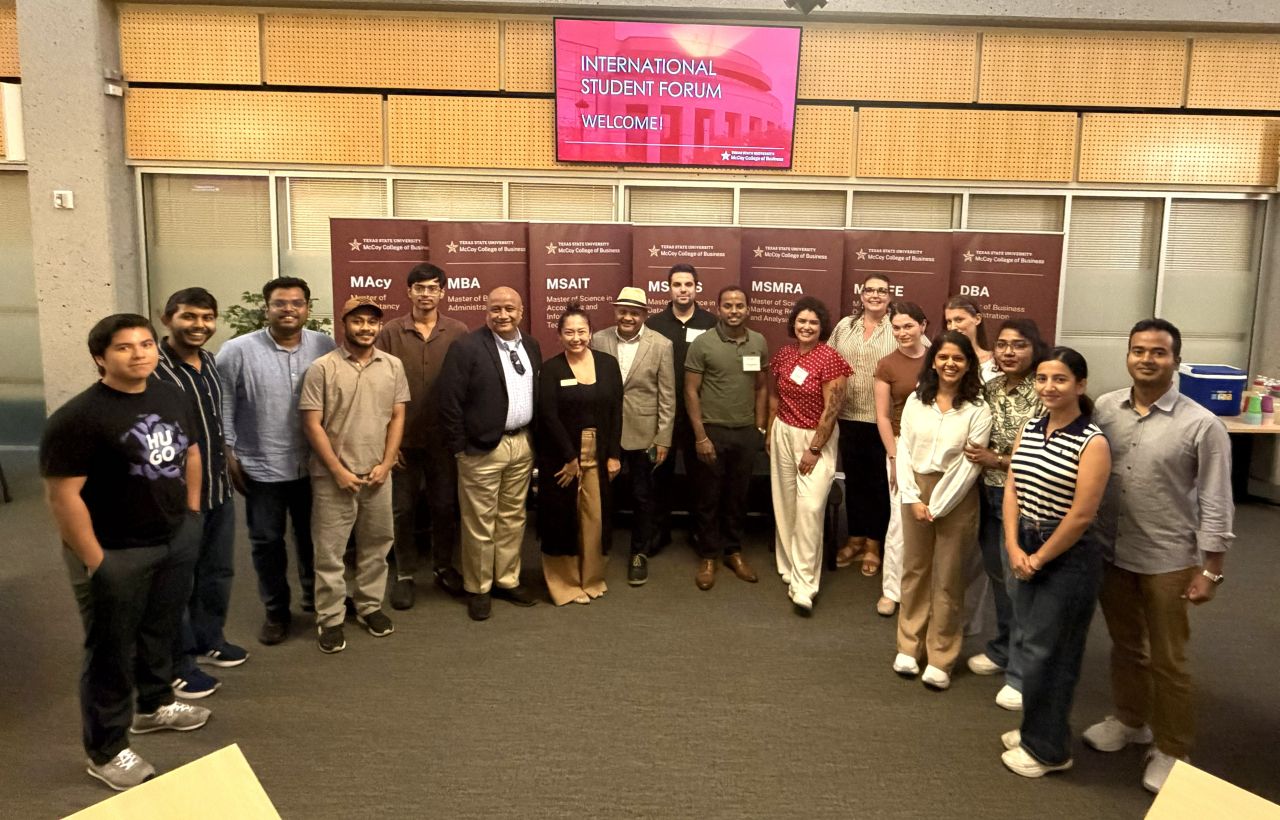 Md Jamil Hasan with faculty and students at the International Student Forum, McCoy College of Business